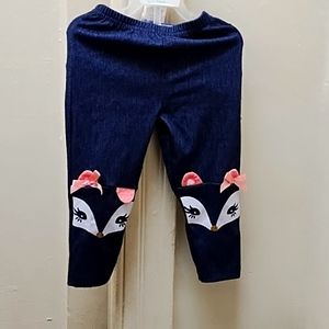 Size 2T denim blue jeans with squirrely girly face printed at knee